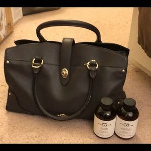 coach dark brown purse with gold detailing